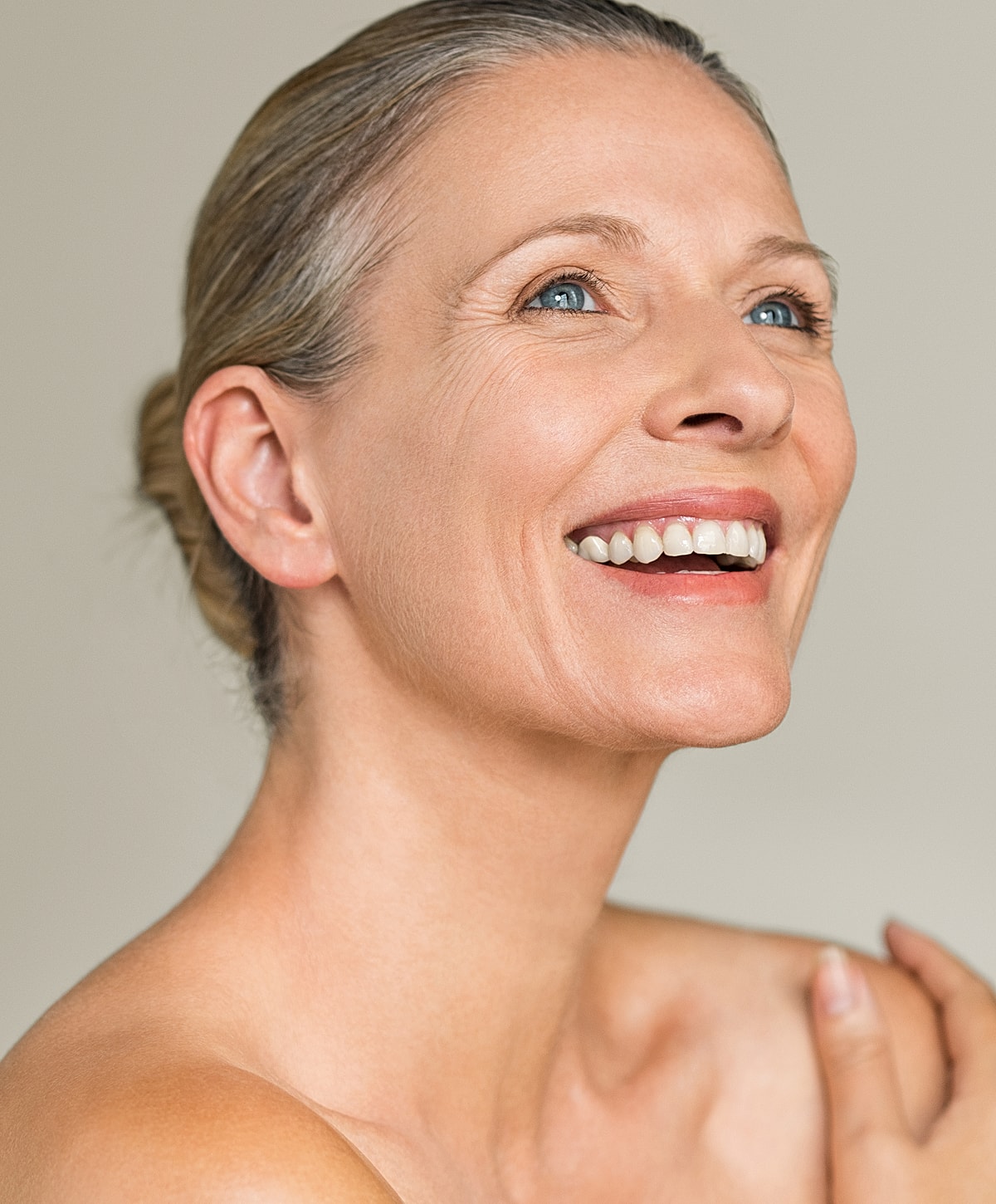 Smiling woman with blue eyes and natural beauty.