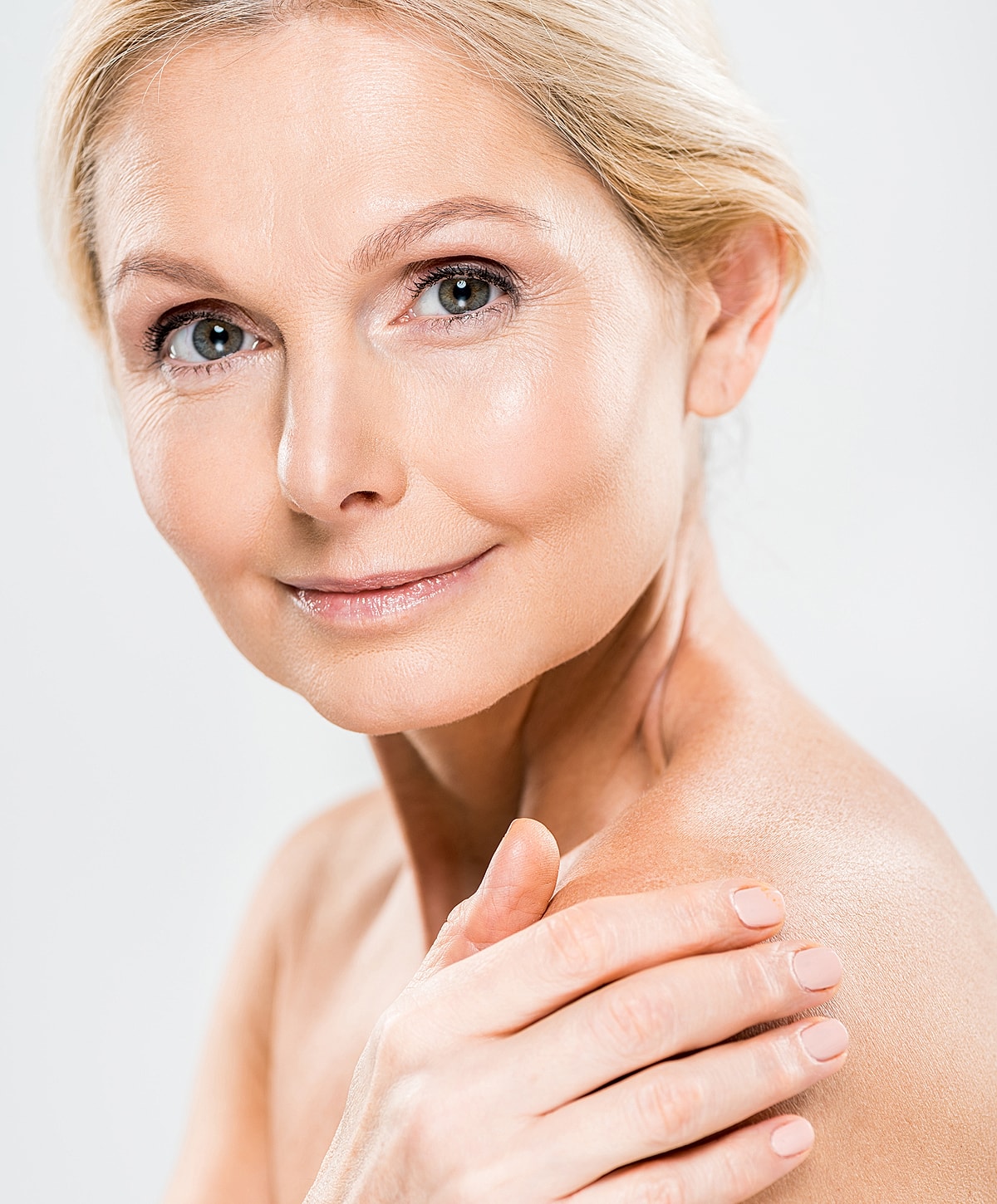 Smiling mature woman with natural makeup.