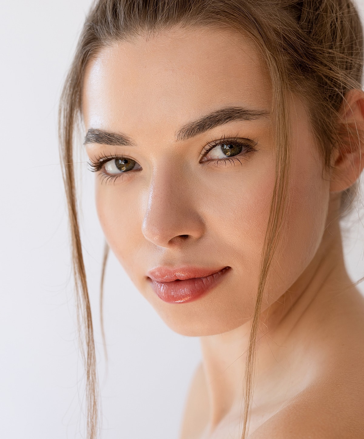 Close-up portrait of a woman with soft features.
