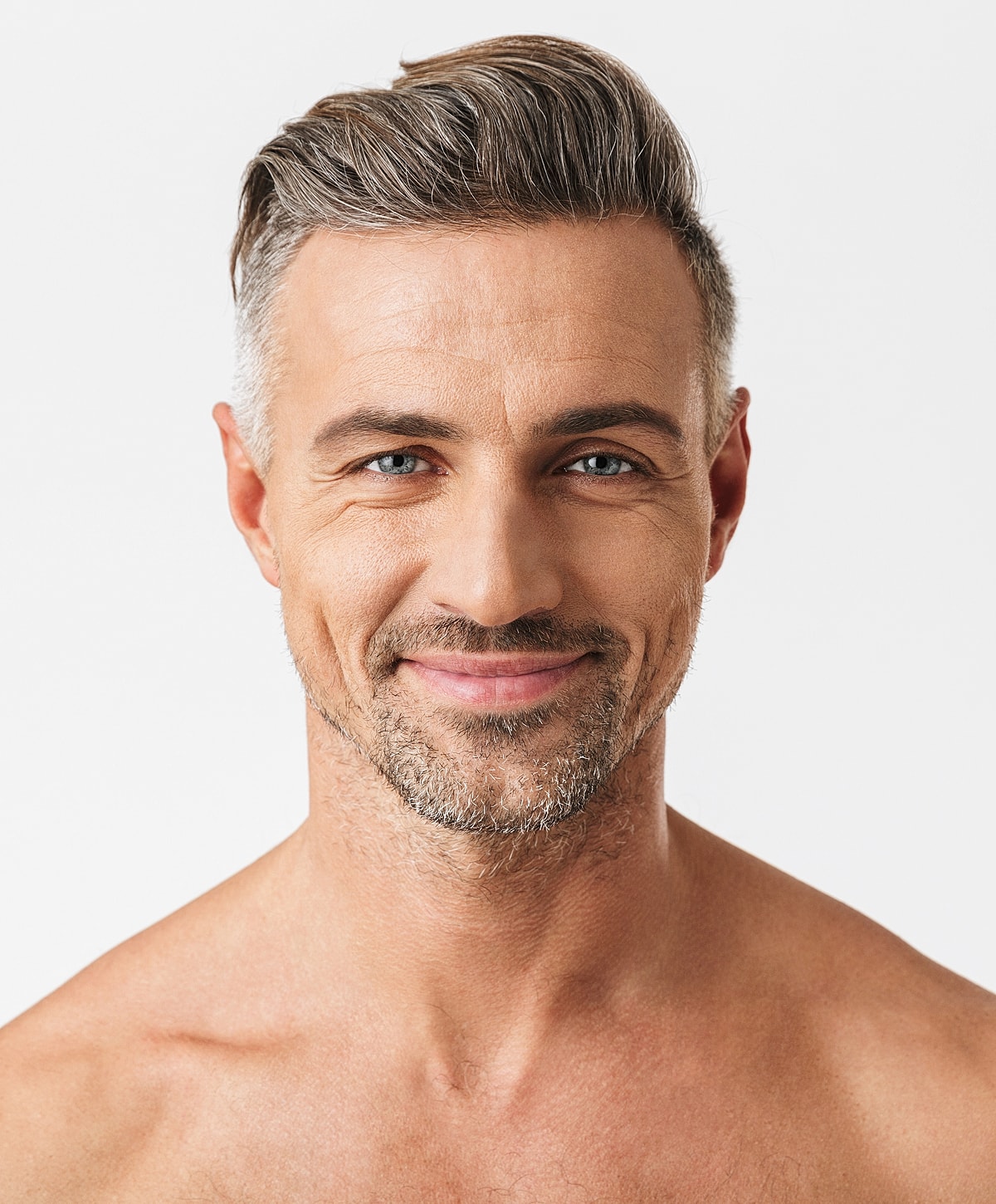 Smiling man with gray hair and stubbly beard.
