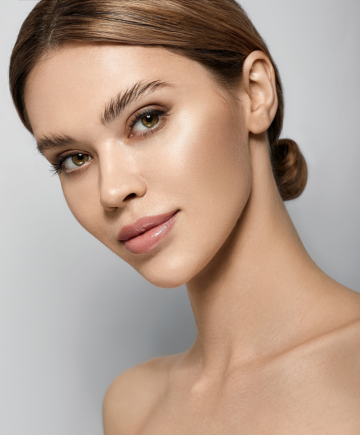 Close-up of a woman’s face with natural makeup.