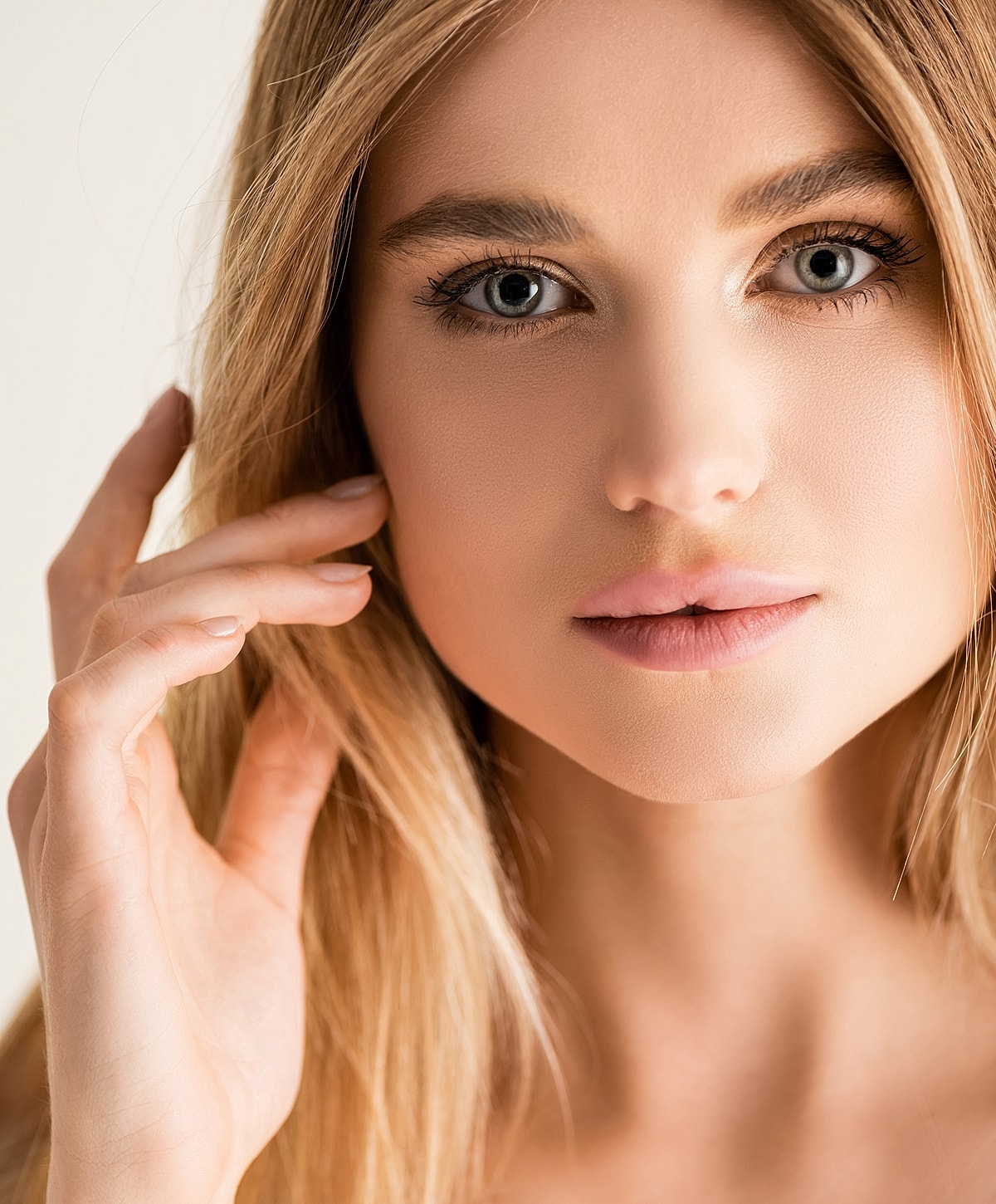 Close-up portrait of a woman with soft features.