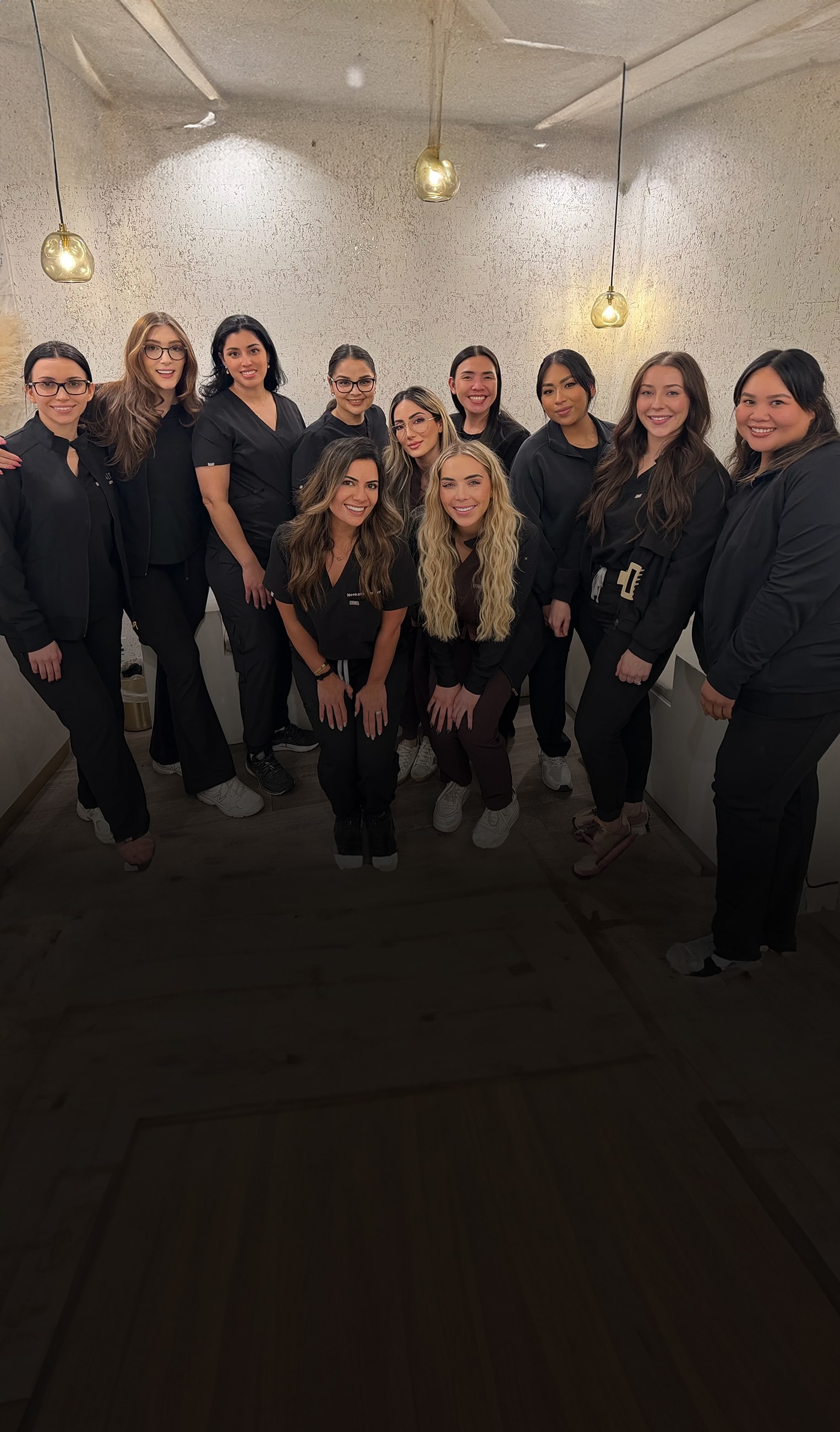 Group of professionals posing together in clinic.
